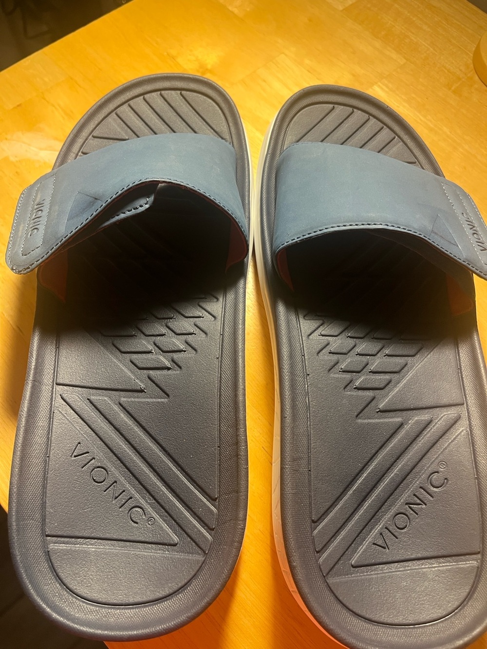 Vionic Rejuvenate Recovery Slides in navy blue.